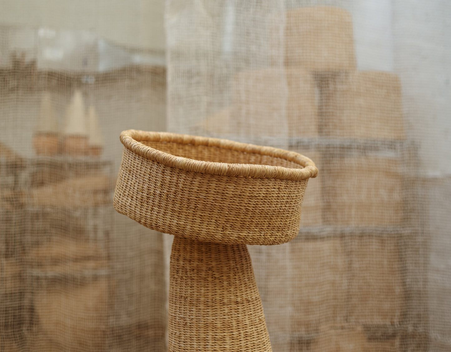 Close up of African made, oversized woven sculpture.