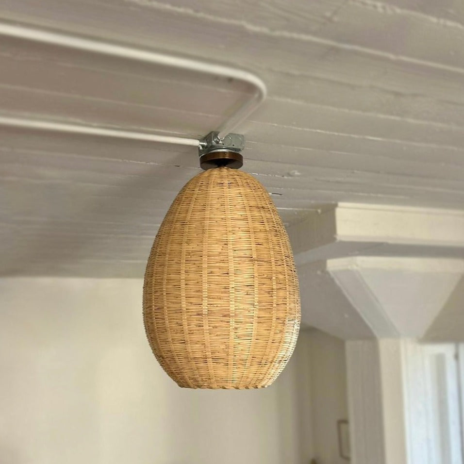 The Brava Light is a large, hand-woven, egg-shaped, ceiling-mounted pendant light, made from a bamboo-like river reed by skilled craftspeople in Oaxaca, Mexico. A perfect light for kitchens, hallways, and living rooms.