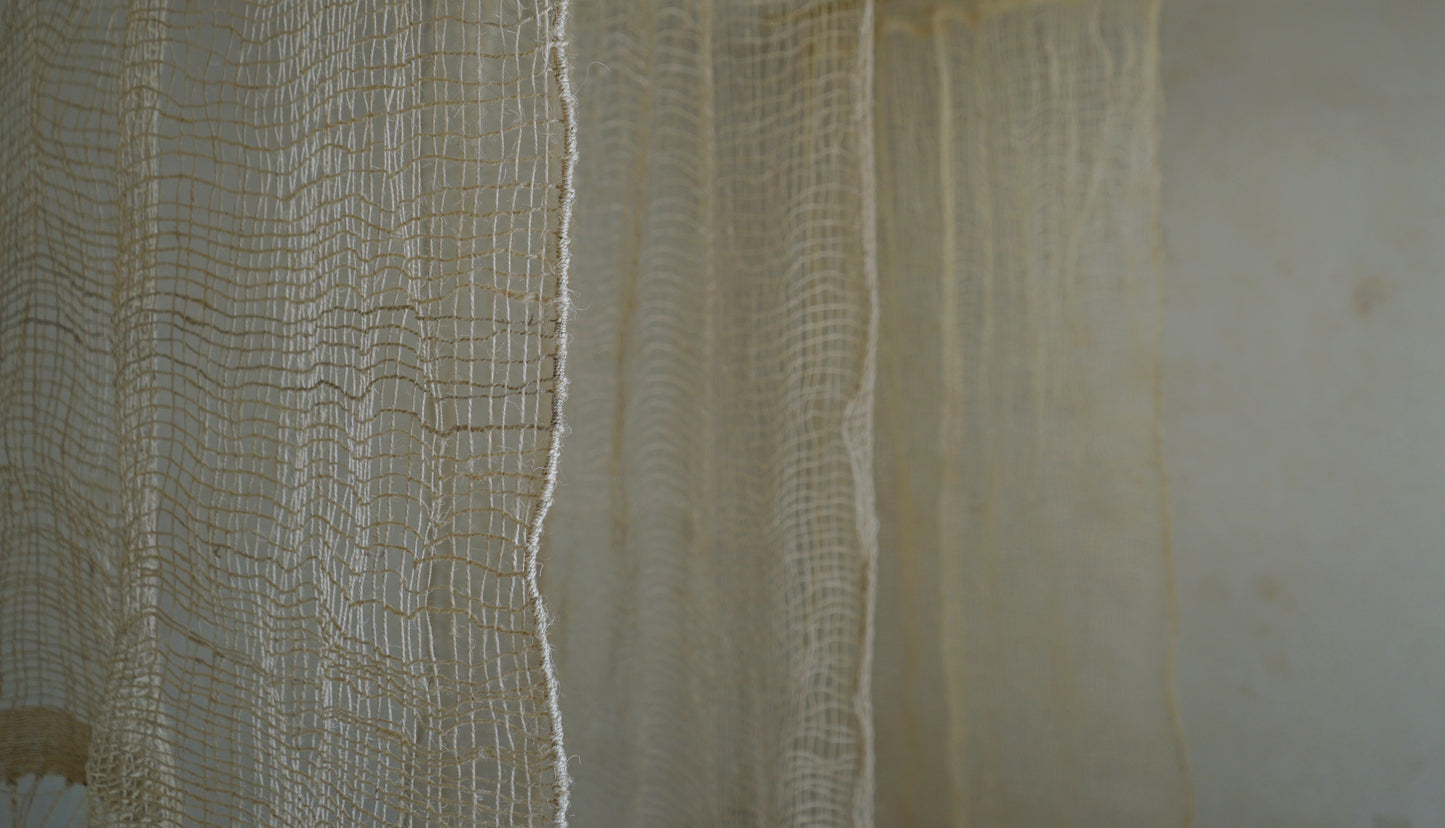 The Cortina Maguey is a handwoven sheer textile hanging, made in Oaxaca, Mexico. These natural colored curtains make beautiful room dividers, window coverings or wall hangings.