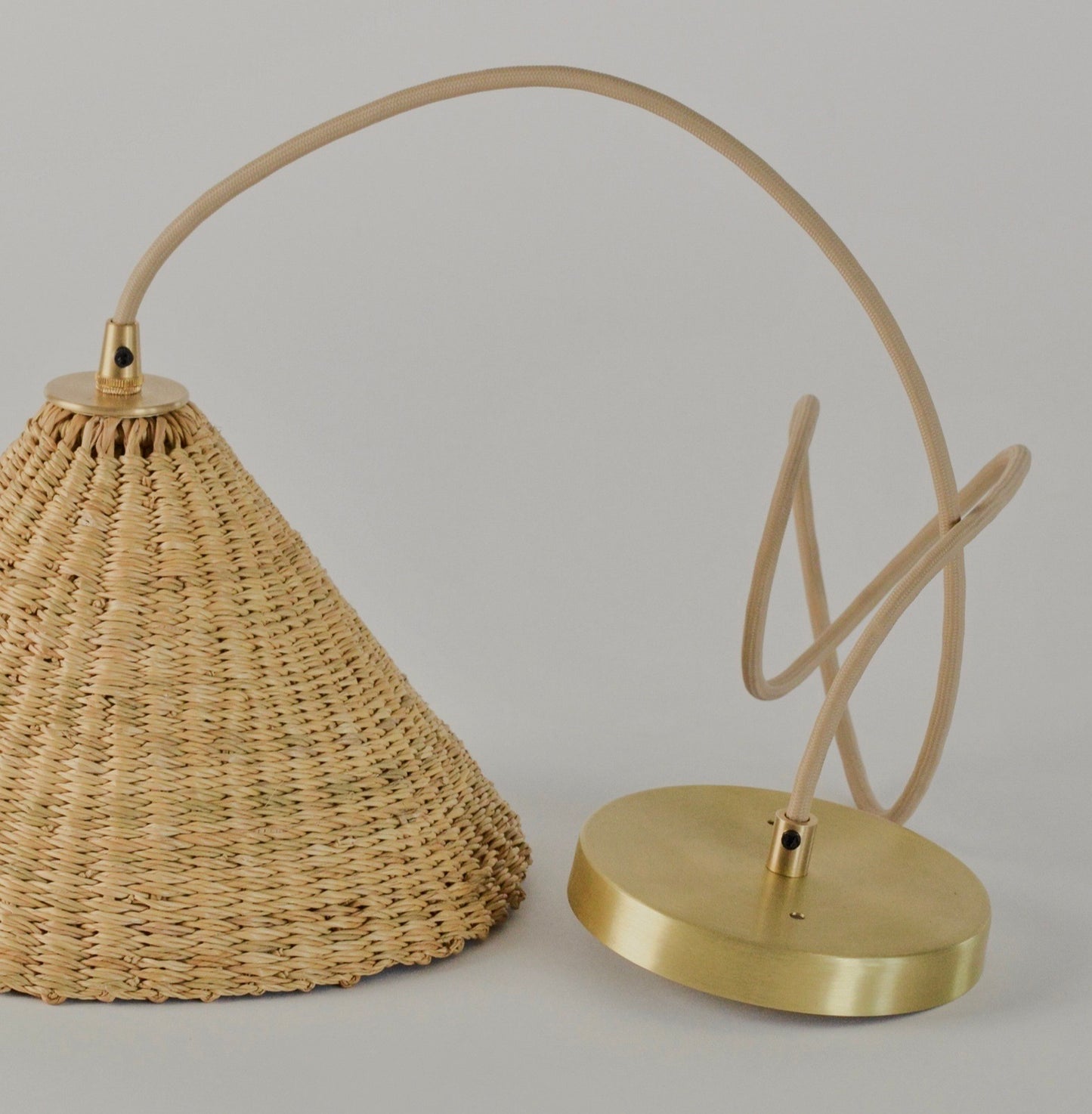 Showing the flush ceiling mount of the hand woven, conical shaped Bonnet pendant light.