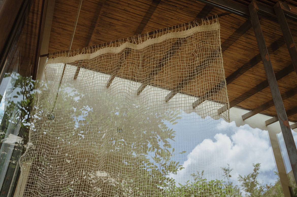 The Cortina Maguey is a handwoven sheer textile hanging, made in Oaxaca, Mexico. These natural colored curtains make beautiful room dividers, window coverings or wall hangings.