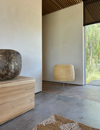 Modern interior with a woven floor lamp.