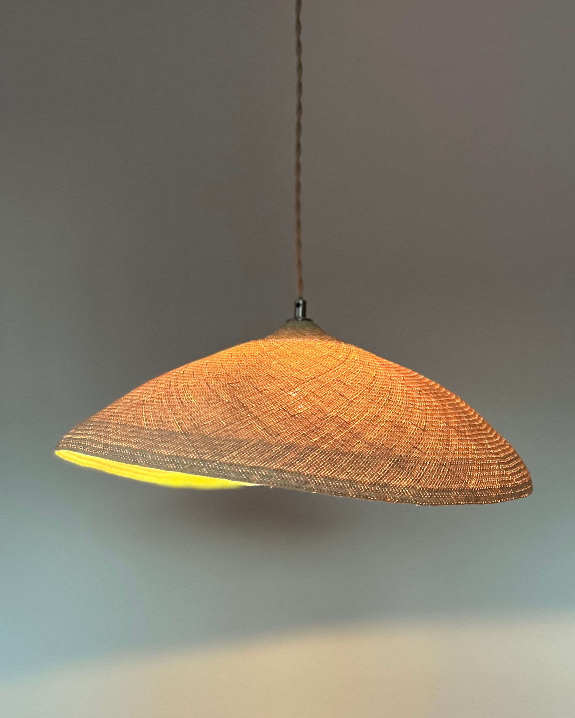 Palma Pendant Light, tightly woven and glowing softly, organic modern style