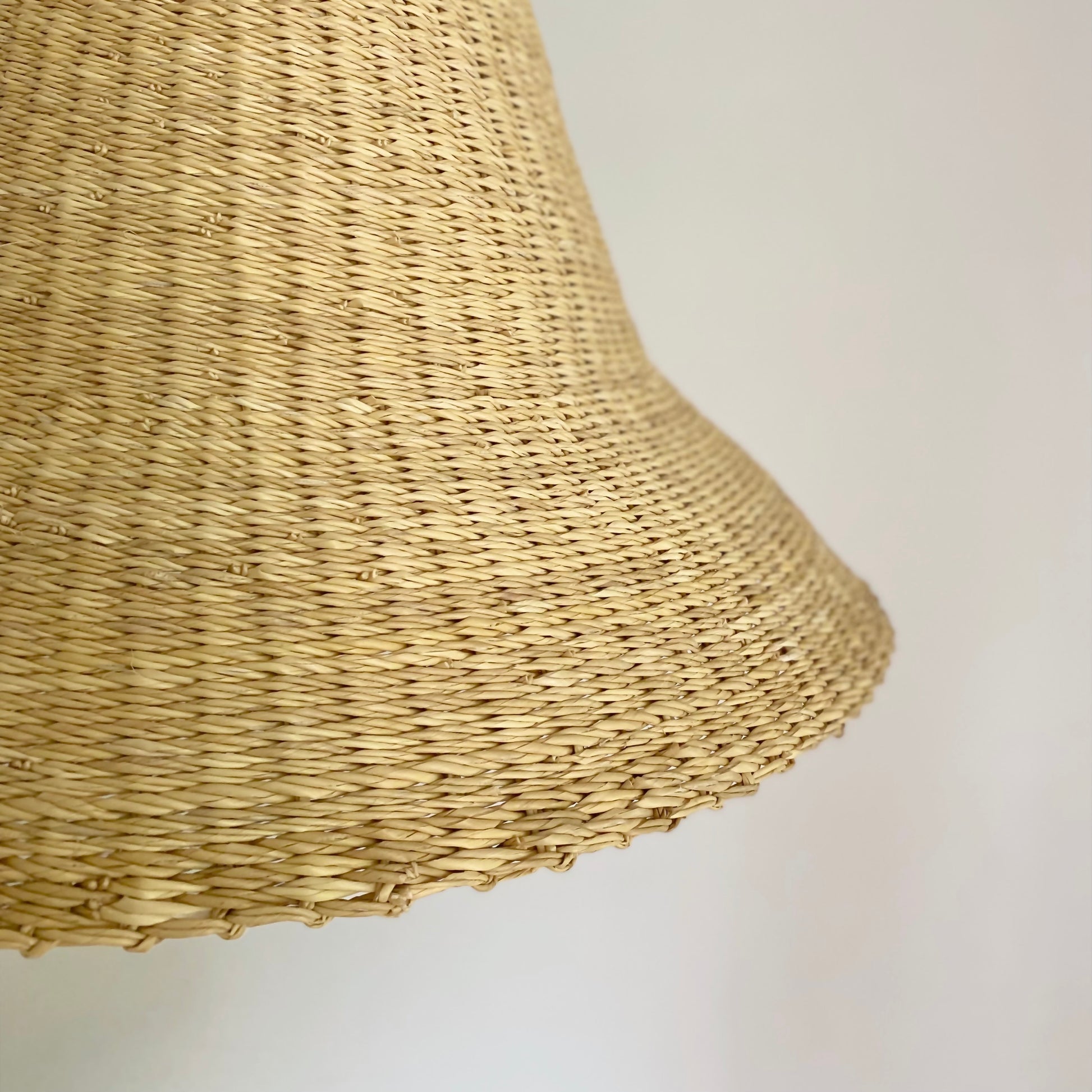 Close of textured hand woven natural lamp shade.